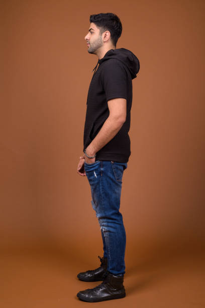 istock Studio shot of young handsome Indian man against colored background 824590160
