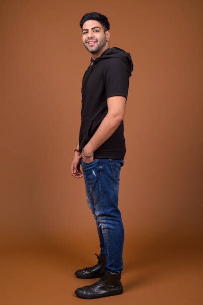 istock Studio shot of young handsome Indian man against colored background 824590166