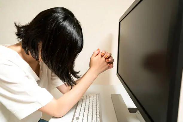 Photo of Businesswoman praying to the display