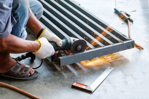 istock Worker cutting metal with grinder with sparks 824592148