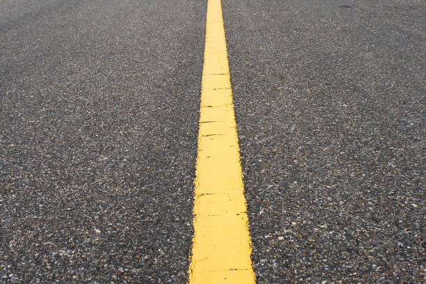 istock Road with yellow line in the center 824594488