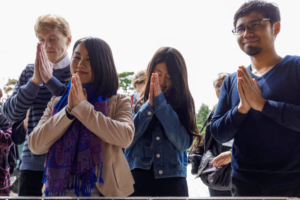 istock Multinational people praying in Japanese temples 824602854