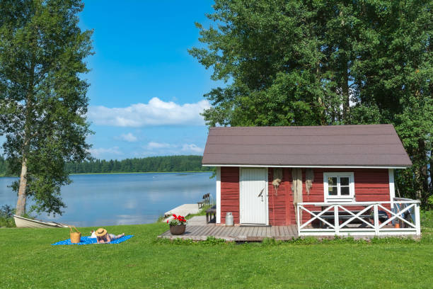 Woman taking sunbath at lake beach