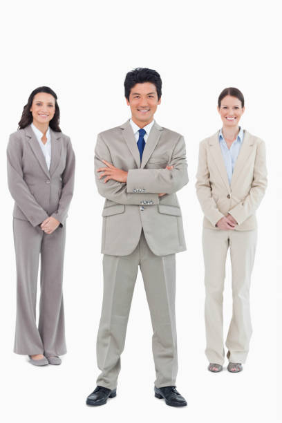 istock Smiling businessman with his staff behind him 824606558