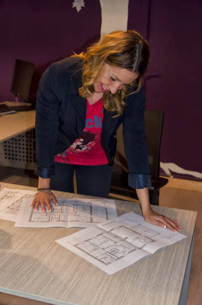 istock Youth engineer looks at the drawings 824608644