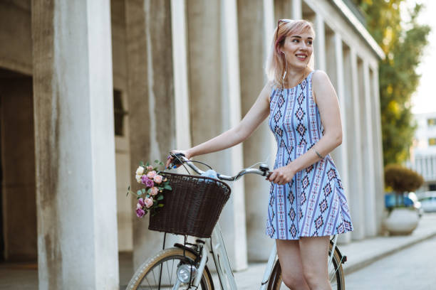 istock Urban woman in downtown with retro bicycle 824609728