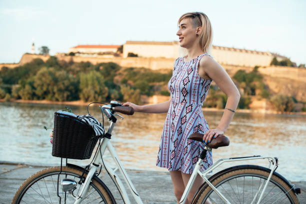 istock Wman with bicycle near river 824609738