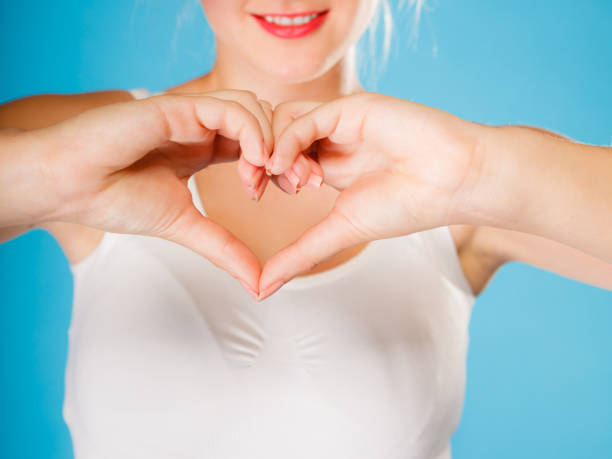 istock Girl hands with heart sign. 824610318