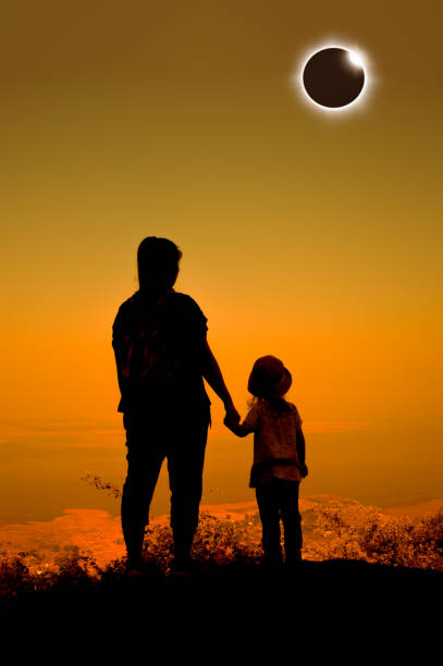 istock Amazing scientific natural phenomenon. Total solar eclipse glowing on sky. 824611228