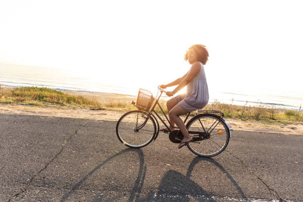 istock Woman cycling on sunny road 824611598