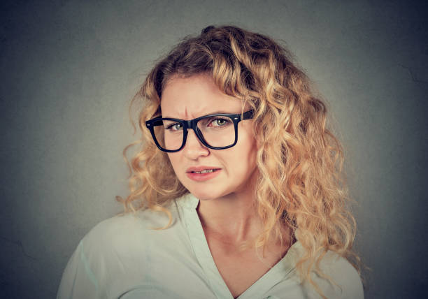 istock Disgusted young woman looking at camera 824613046
