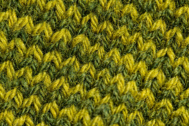 istock A beautiful closeup of a hand knitted warm and soft wool pattern. Soft socks or scarf of natural wool. 824614204