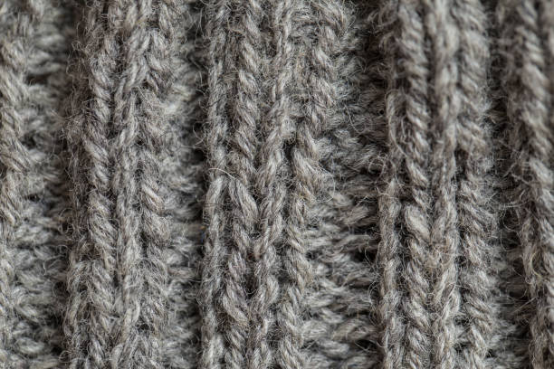 istock A beautiful closeup of a hand knitted warm and soft wool pattern. Soft socks or scarf of natural wool. 824614558