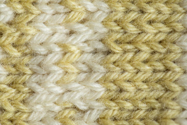 istock A beautiful closeup of a hand knitted warm and soft wool pattern. Soft socks or scarf of natural wool. 824615332