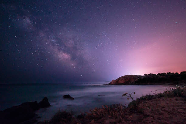 Milky way in the sky of Sardinia A beautiful milky way in the sky of Sardinia in a day of summerA beautiful milky way in the sky of Sardinia in a day of summer sun exposure stock pictures, royalty-free photos & images