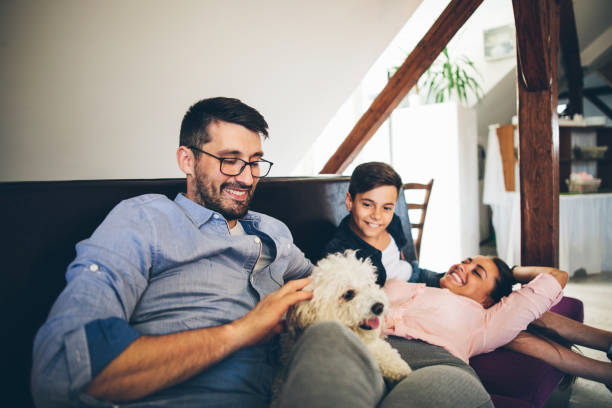 istock Happy Family With Dog at Home 824616964