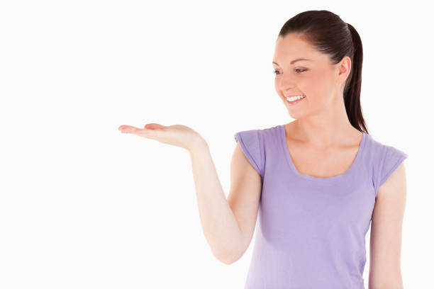 istock Gorgeous woman showing a copy space 824617660