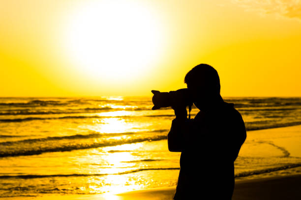 istock Nature photographer by the sea 824617980