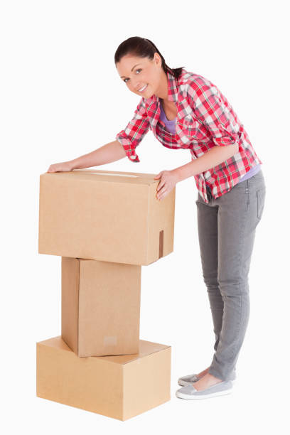 istock Good looking woman posing with cardboard boxes while standing 824618114