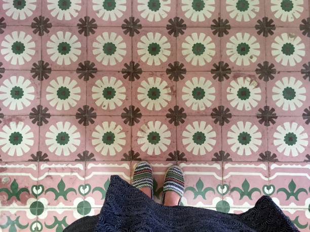 istock Feet over vintage tiled floor 824618772