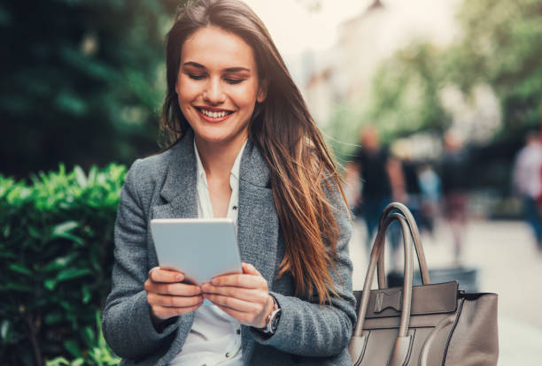 istock Woman using tablet in the city 824620938
