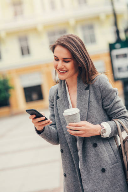 istock Woman texting in the city 824620974