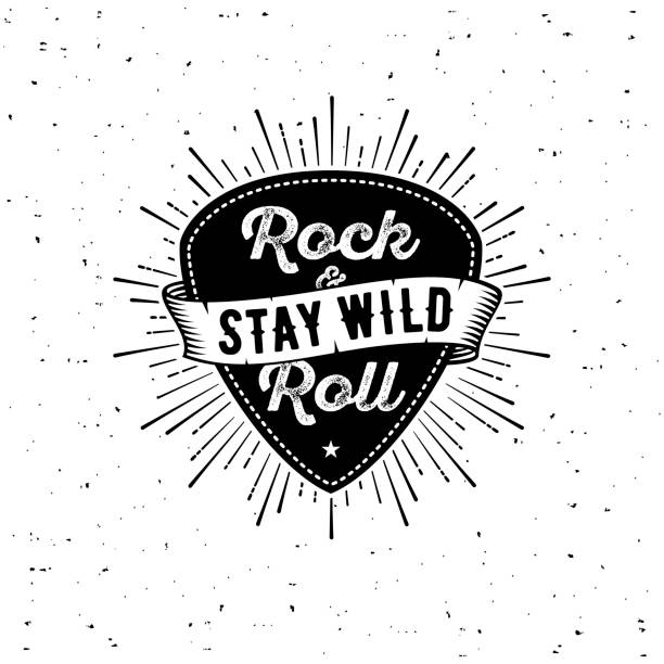 Rock n Roll white Rock and Roll sign. Stay wild. Slogan graphic for t shirt. Poster with plectrum, ribbon, starburst. hardcore music style stock illustrations