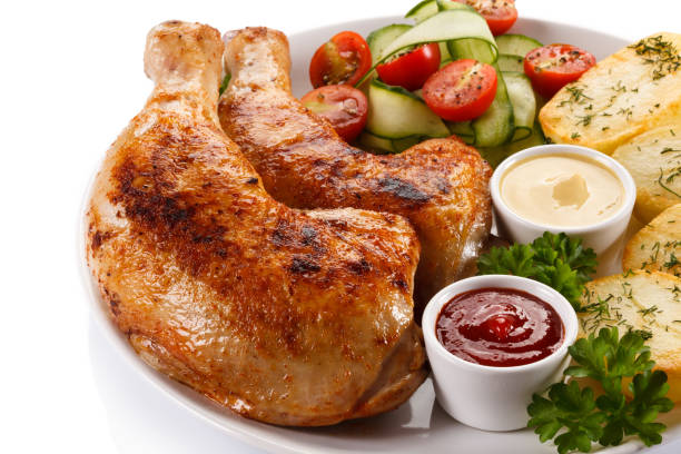 istock Roast chicken leg and vegetables 824624388