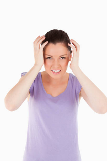 istock Good looking woman having a migraine while standing 824624600