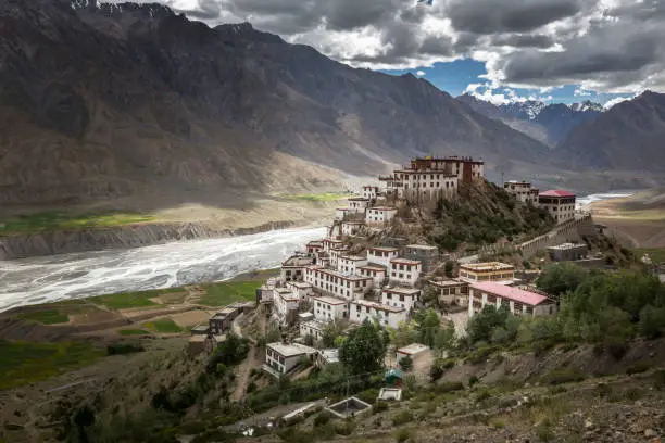 key monastery or ki monastery, spiti valley, himachal pradesh, india surrounded by mountains, river and clouds