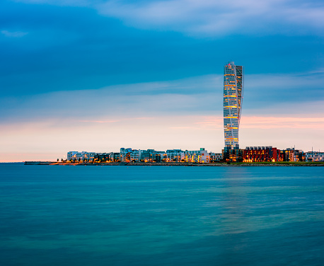 Skyline of Malmo Sweden with Famous Turning Torso Building, captured around sunset.