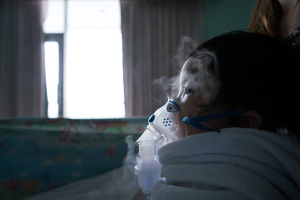 istock children has a cold with breathing treatment in the oxygen 824635192