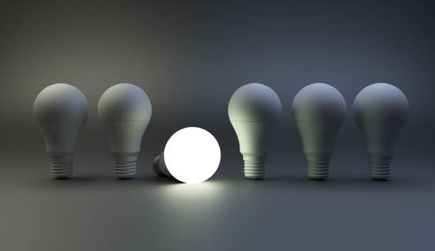 istock Row of light bulbs on dark background. Creative idea concepts. 824638826