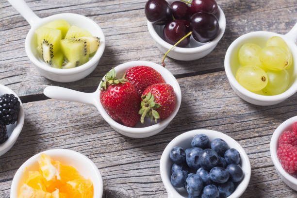 istock Fruits and berries in bowl 824639330