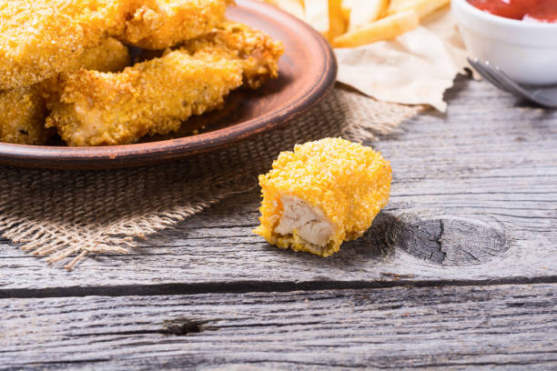 istock chicken strips and French fries 824639478