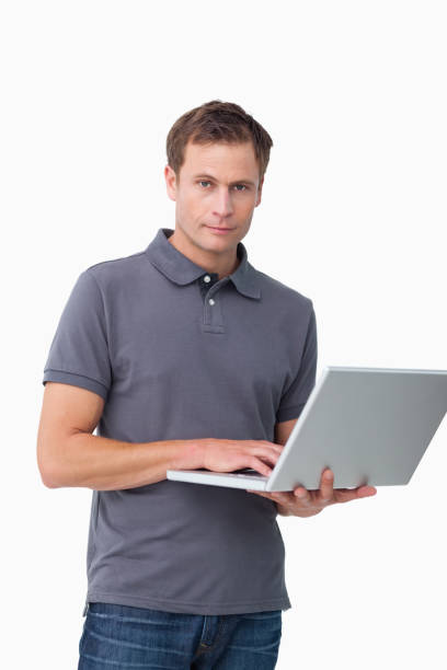 istock Young man standing with his laptop 824642184