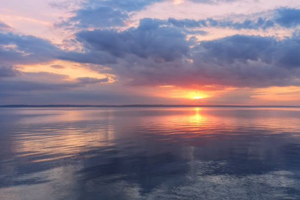 istock sunrise on the water 824643046