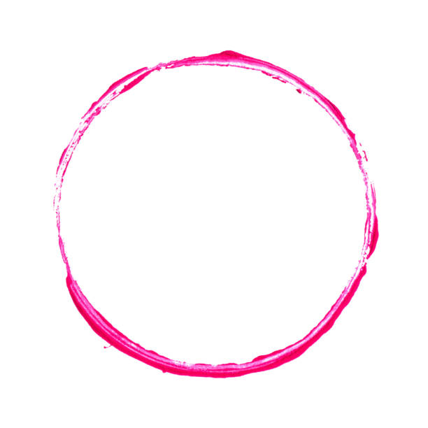 Pink brush stroke circle frame in lipstick isolated on white background