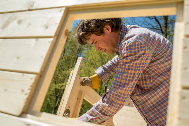 istock Carpenter building a wooden outdoor hut 824644738