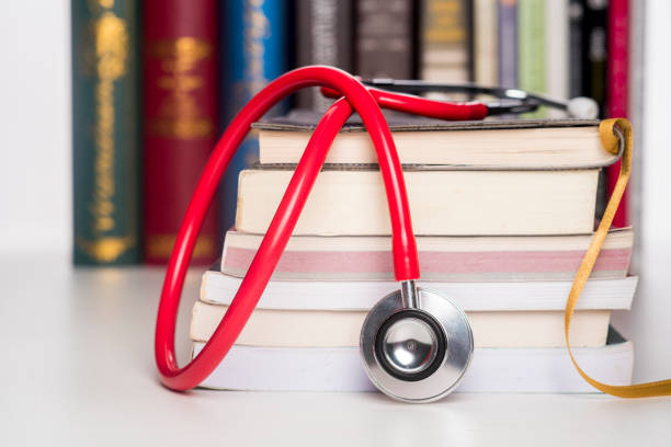 concept of medical education with book and stethoscope - medical student healthcare and medicine book education imagens e fotografias de stock