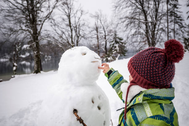 istock Young child making a winter snowman 824645942