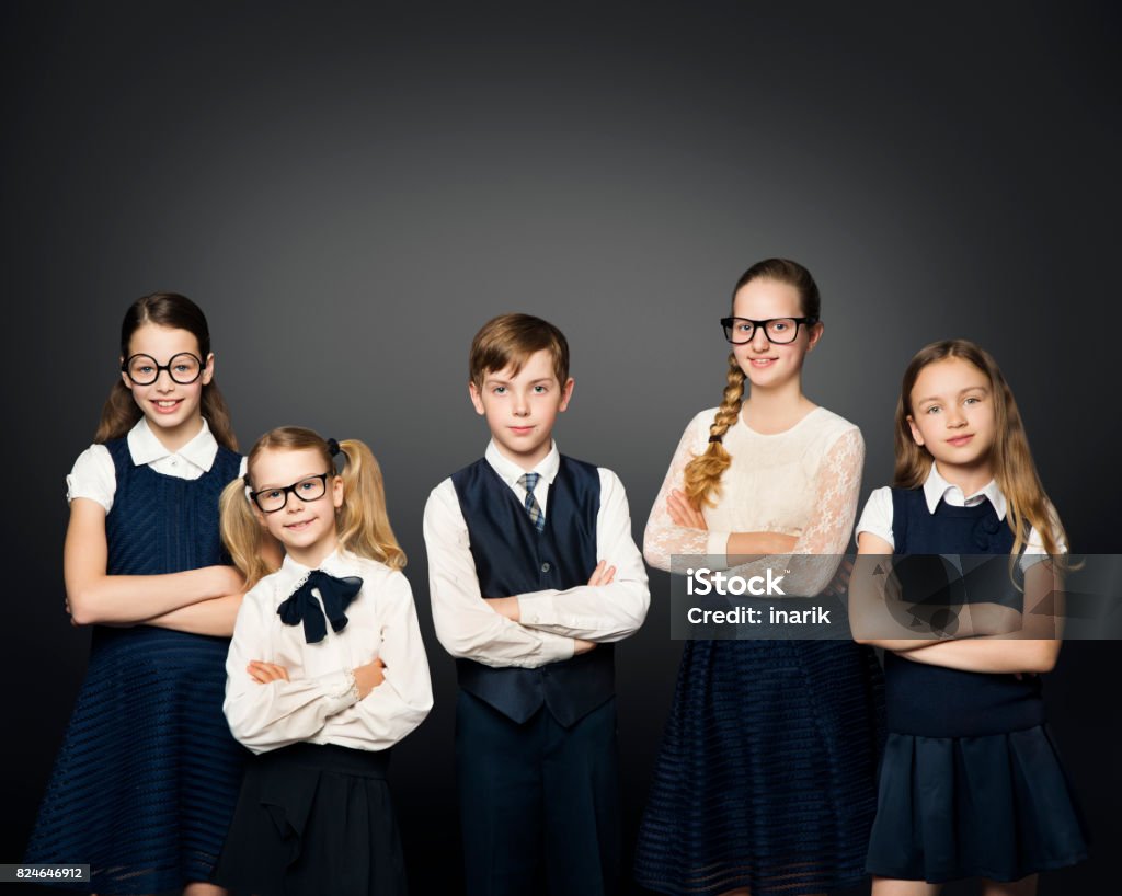 School Children Group, Girls and Boy Students In Uniform over Black Background Black Background Stock Photo