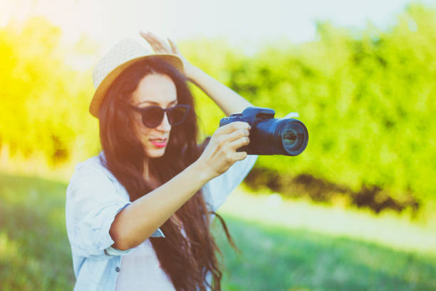 istock Attractive young woman taking pictures 824647004