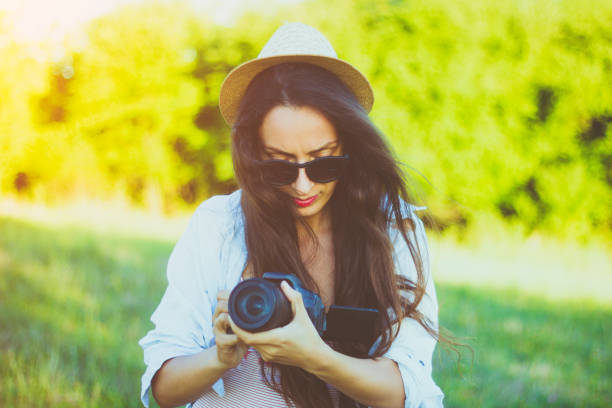 istock Attractive young woman taking pictures 824647046
