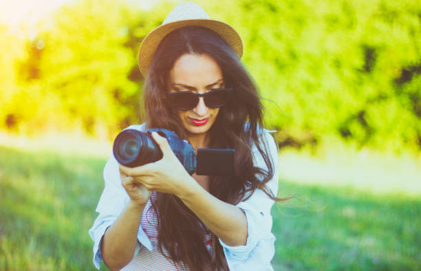 istock Attractive young woman taking pictures 824647598