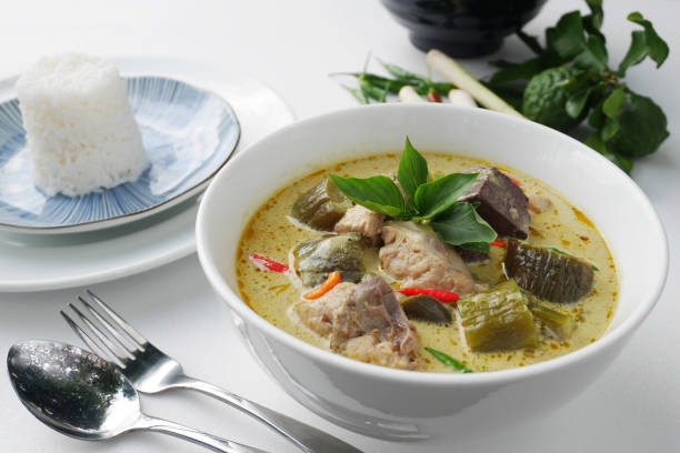istock Thai Chicken green curry in white bowl  served with Thai jasmine rice 824649466