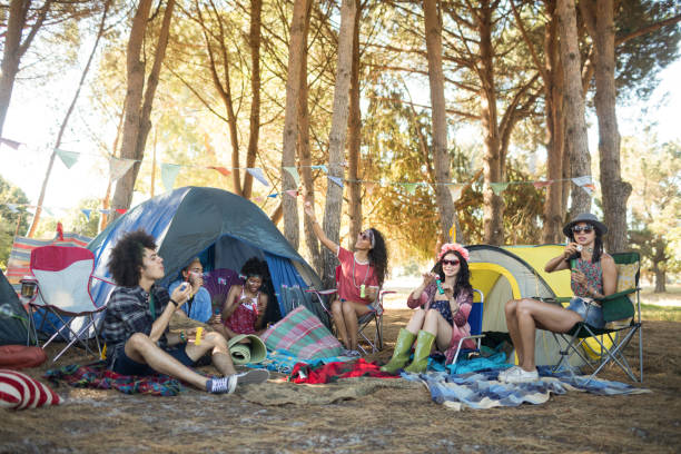 istock Young friends enjoying together at campsite 824651072