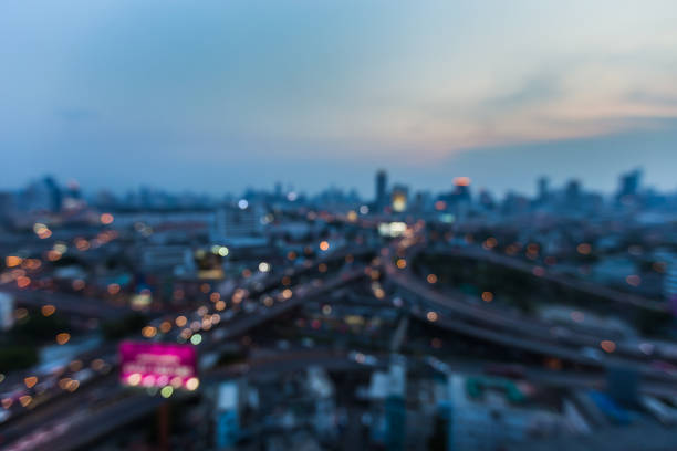 istock Night aerial view, blurred bokeh light city and overpass 824652096