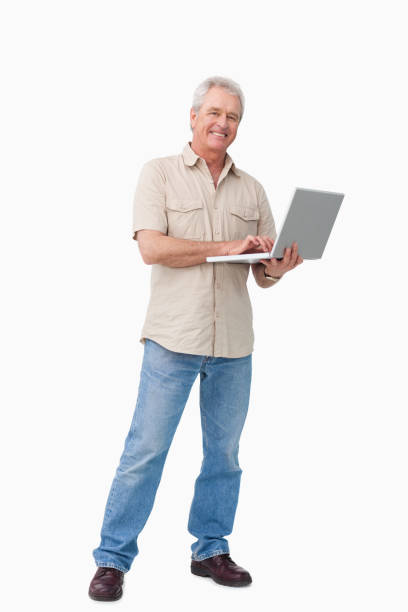 istock Smiling mature male with his laptop 824652196
