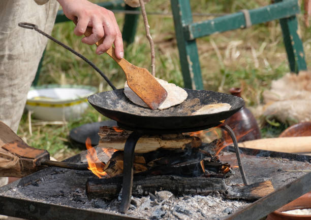 istock Cooking loaves of bread on the fire 824657446